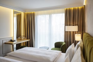 Chambre Deluxe | Literie de qualité, coffre-fort, rideaux d’obscurcissement