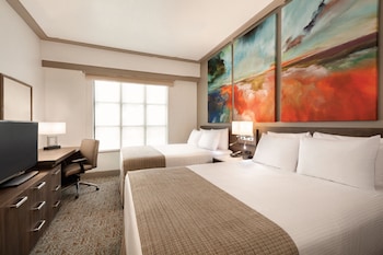 Hypo-allergenic bedding, in-room safe, desk, laptop workspace at Buena Vista Suites Orlando