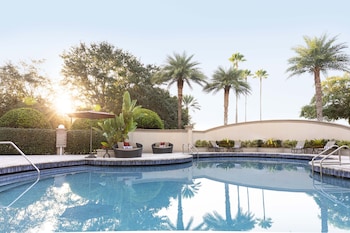 Outdoor pool, open 8:00 AM to 11:00 PM, pool umbrellas, sun loungers at Buena Vista Suites Orlando