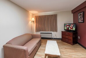 Suite, 1 King Bed, Non Smoking | 1 bedroom, in-room safe, desk, blackout drapes