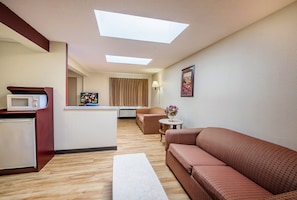 Suite, 1 King Bed, Non Smoking | In-room safe, desk, blackout curtains, free cots/infant beds