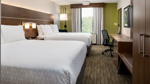 A hotel room with two beds, a desk, a chair, a TV, and a window with curtains. - Holiday Inn Express Atlanta Airport - College Park by IHG (College Park)