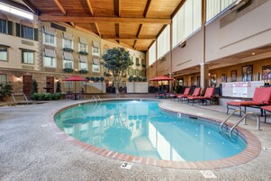 Indoor pool, open 7:00 AM to 11:00 PM, pool umbrellas