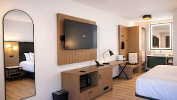 Premium bedding, pillow-top beds, desk, laptop workspace