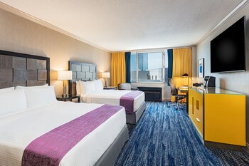 Hypo-allergenic bedding, down comforters, pillowtop beds, minibar at E-Central Downtown Los Angeles Hotel