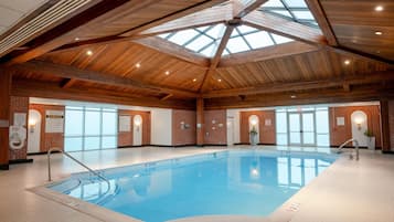 Indoor pool, open 9:00 AM to 11:00 AM, pool loungers