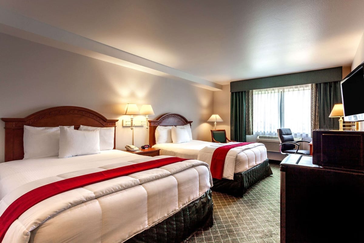 Desk, blackout drapes, iron/ironing board, free cribs/infant beds