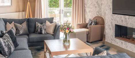 The Belfry Suite | Living area | 32-inch plasma TV with satellite channels, TV