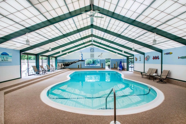 Indoor pool, open 9:00 AM to 9:00 PM, pool umbrellas, sun loungers