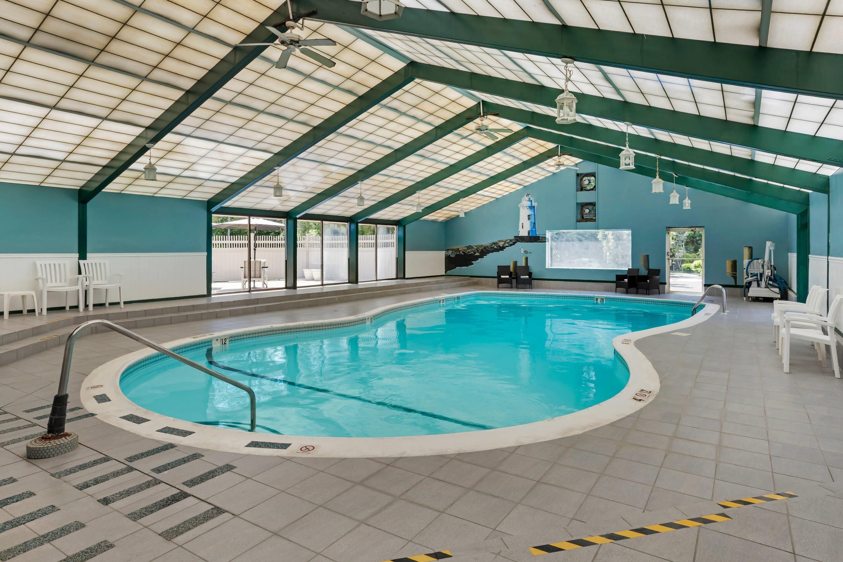 Indoor pool, open 9:00 AM to 9:00 PM, pool umbrellas, sun loungers