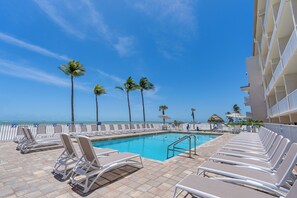 Outdoor pool, open 9:00 AM to 6:00 PM, pool umbrellas, pool loungers