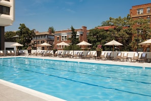 Seasonal outdoor pool, open 6:00 AM to 10:00 PM, pool umbrellas