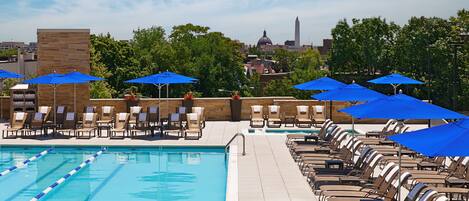 Seasonal outdoor pool, open 6:00 AM to 10:00 PM, pool umbrellas