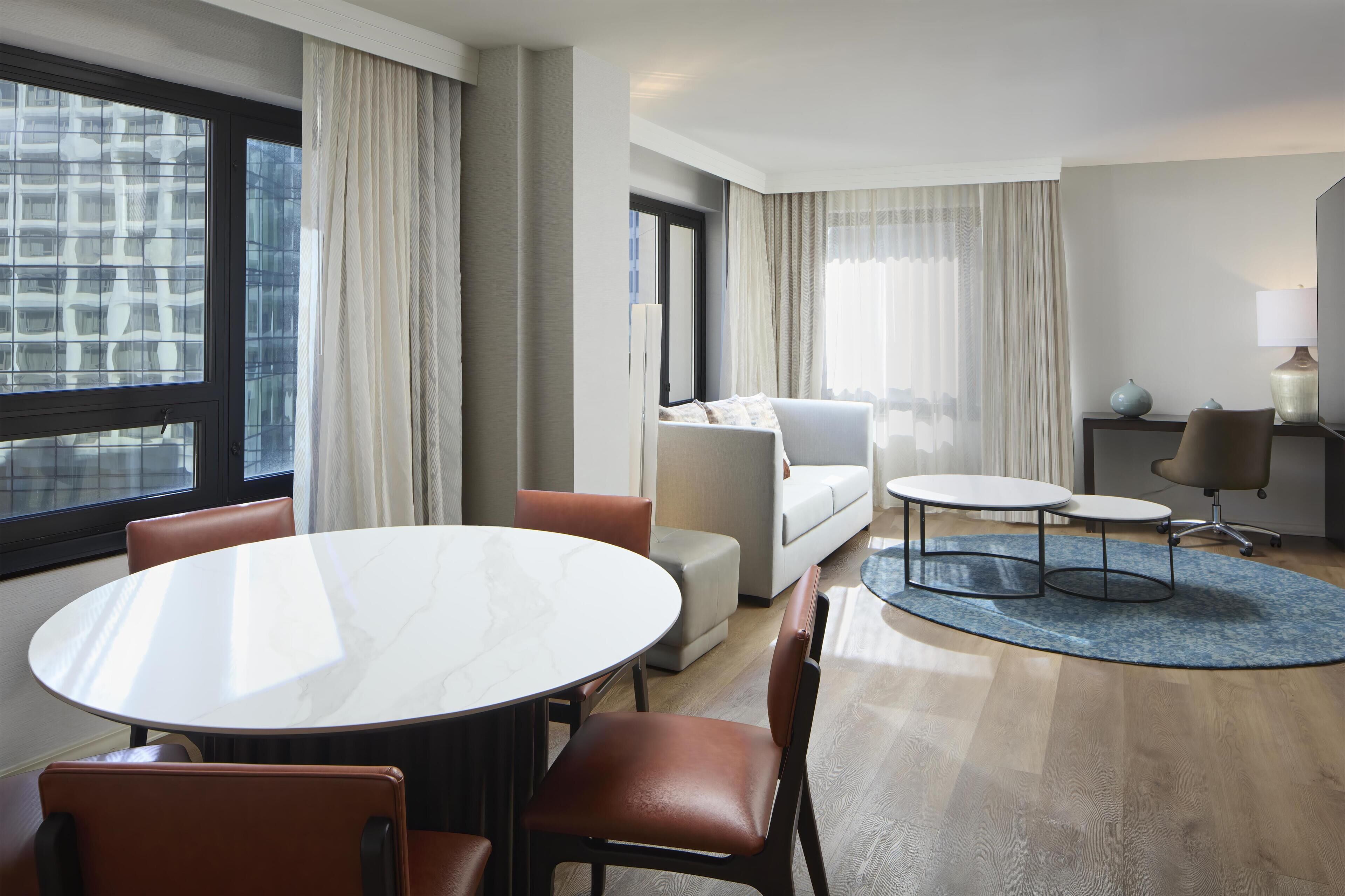 Suite, 1 King Bed | Living area | 55-inch LCD TV with cable channels, TV