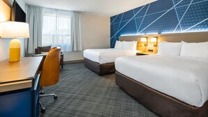 A hotel room with two beds, a desk, a chair, and a large window with curtains. - Comfort Inn & Suites Barrie - Highway 400 (Barrie)