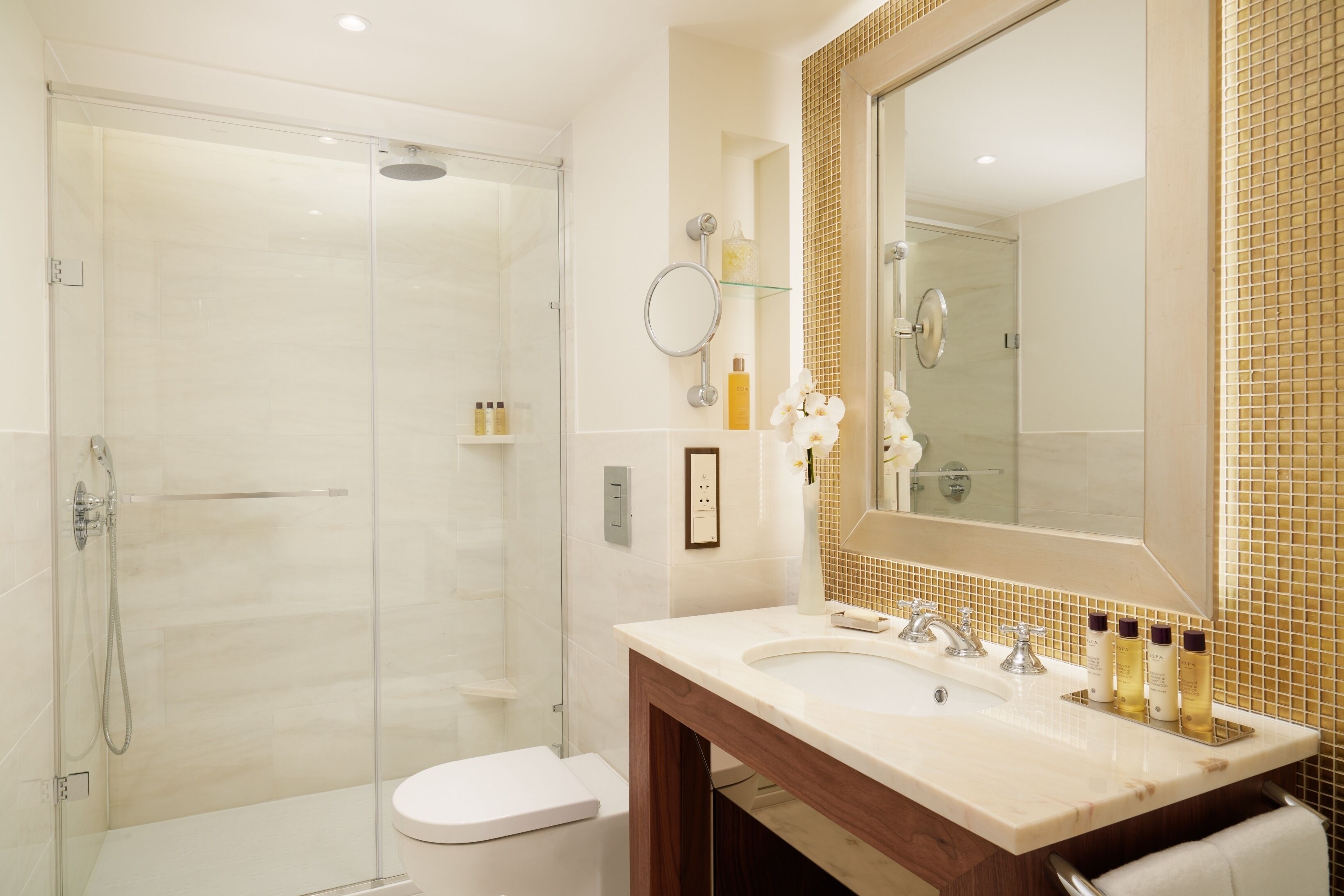 designer toiletries, hair dryer, bathrobes, slippers