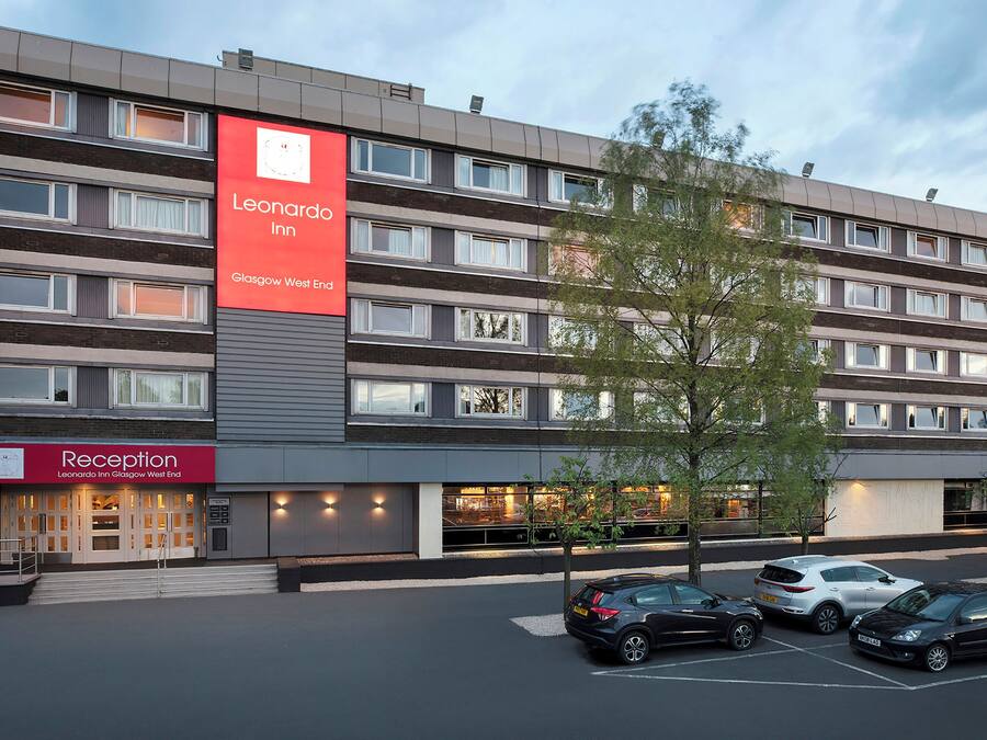 A multi-story hotel with a prominent red sign for the Leonard Hotel Glasgow West End.
