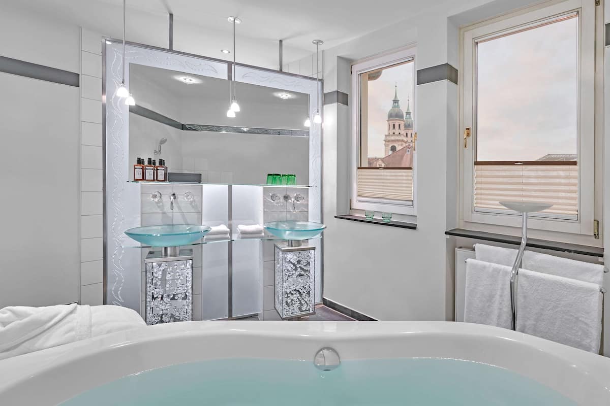 signature suite | bathroom | shower, hair dryer, towels