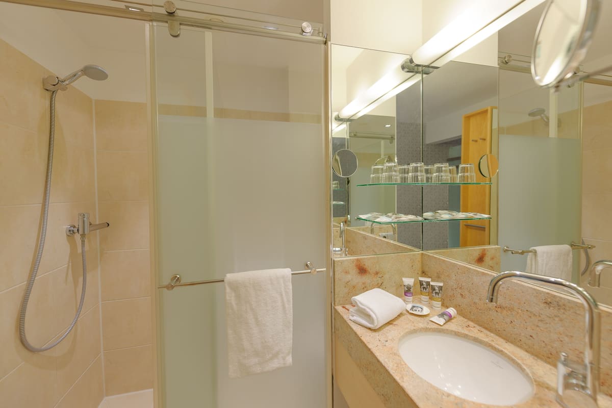 shower, eco-friendly toiletries, hair dryer, towels