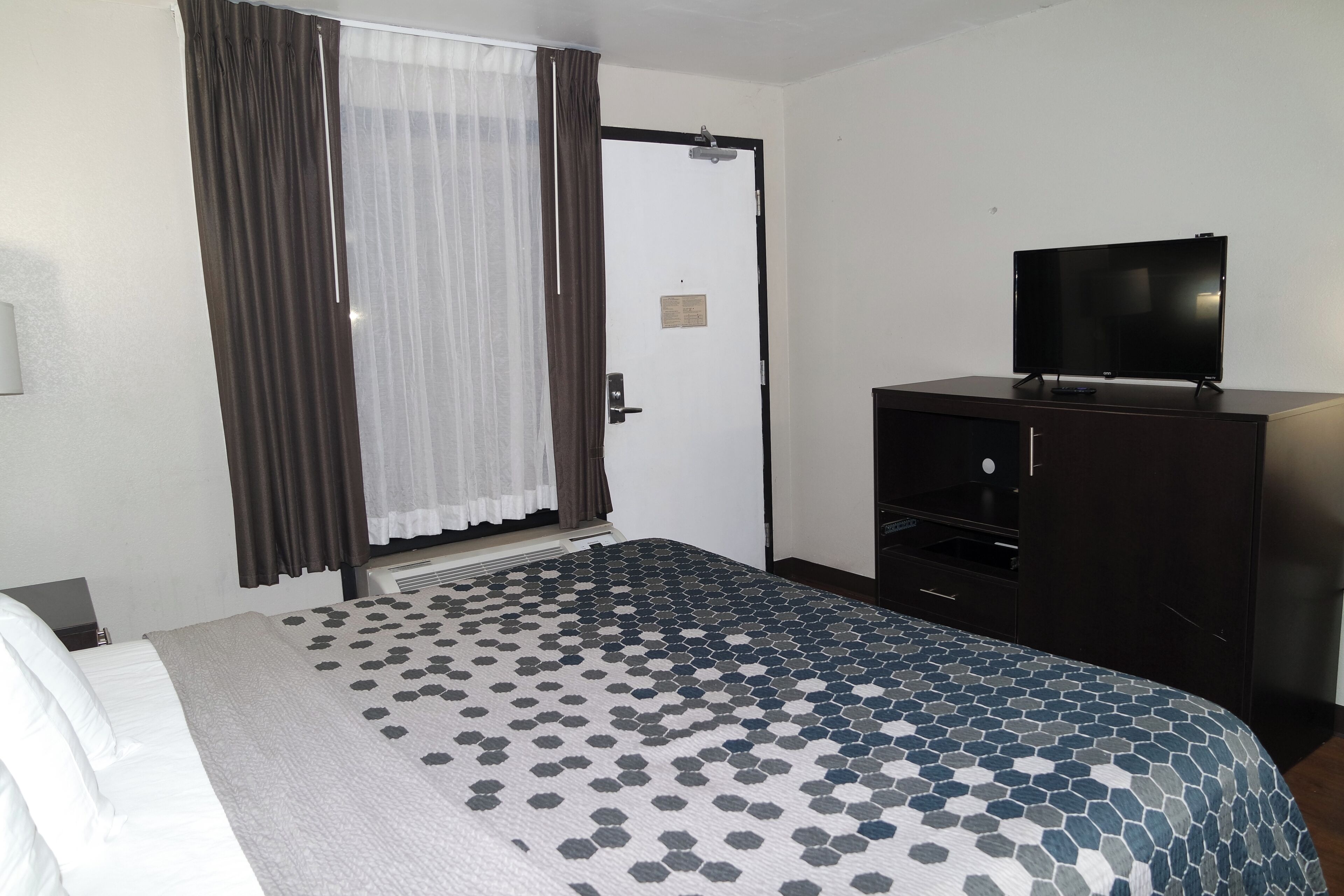 Desk, laptop workspace, blackout curtains, iron/ironing board