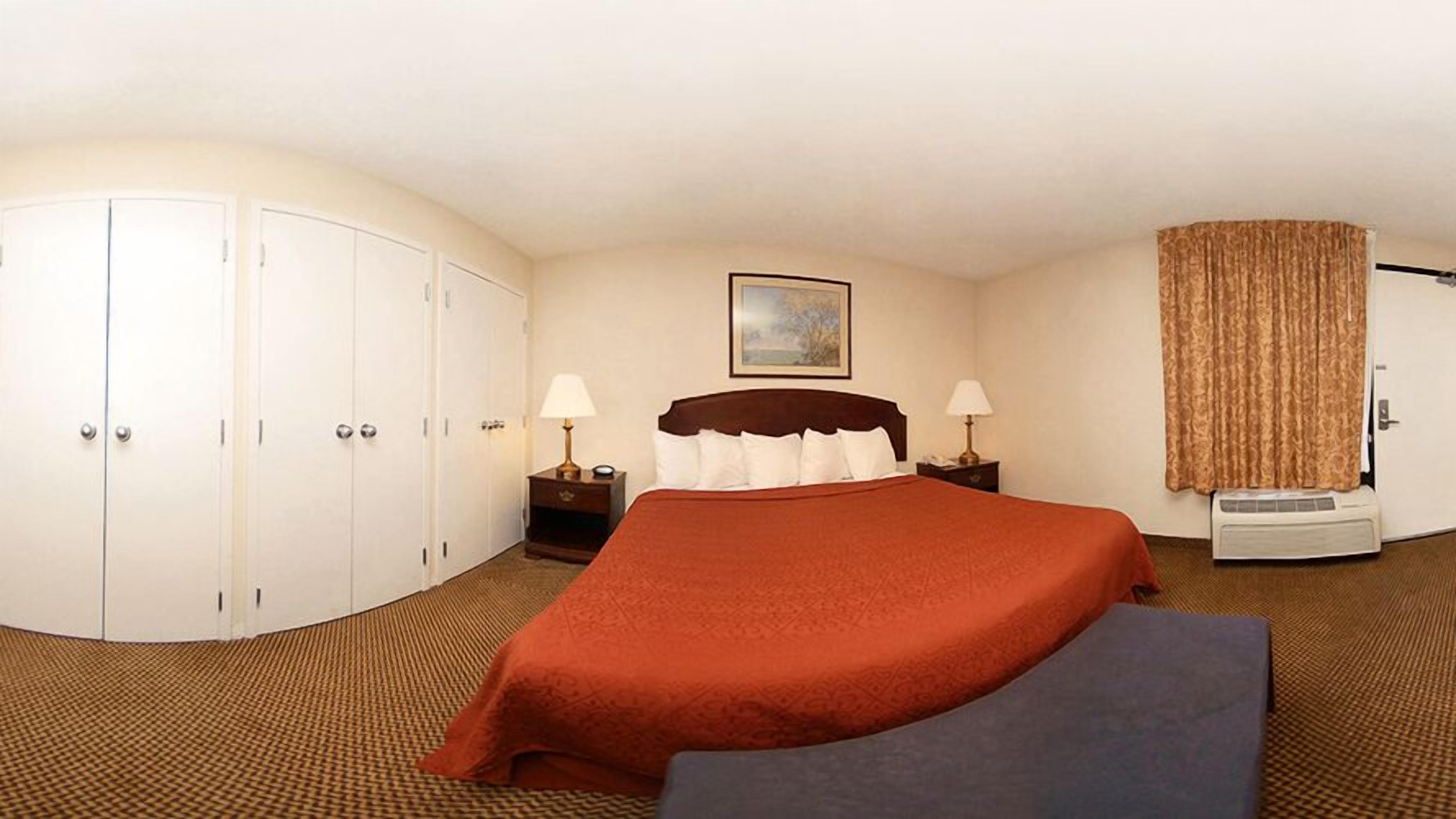 Desk, laptop workspace, blackout drapes, iron/ironing board