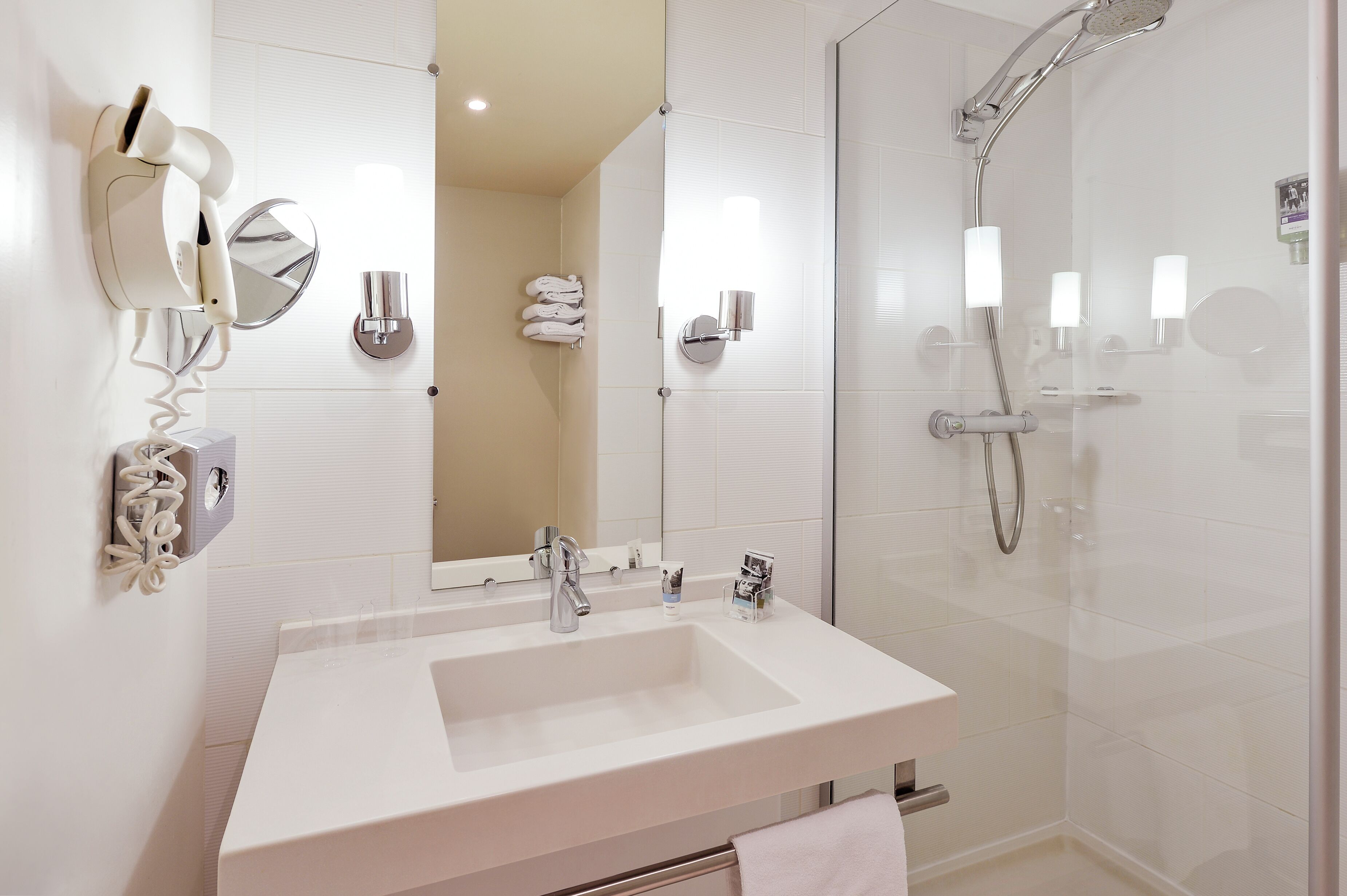 eco-friendly toiletries, hair dryer, towels, soap