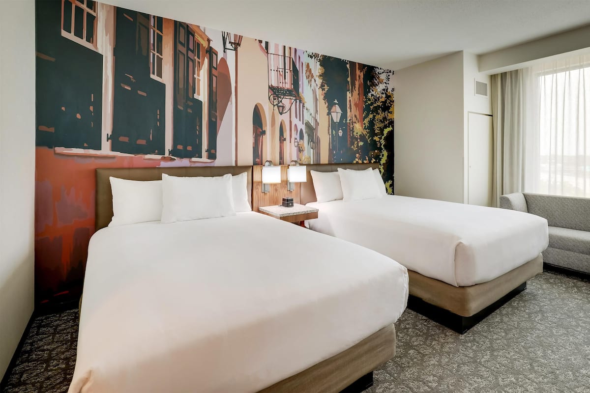 Premium bedding, desk, laptop workspace, blackout drapes