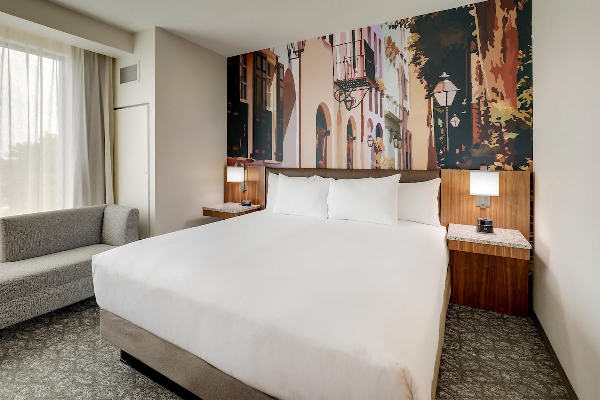 Premium bedding, desk, laptop workspace, blackout drapes