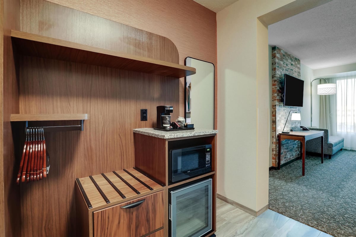 Premium bedding, desk, laptop workspace, blackout drapes