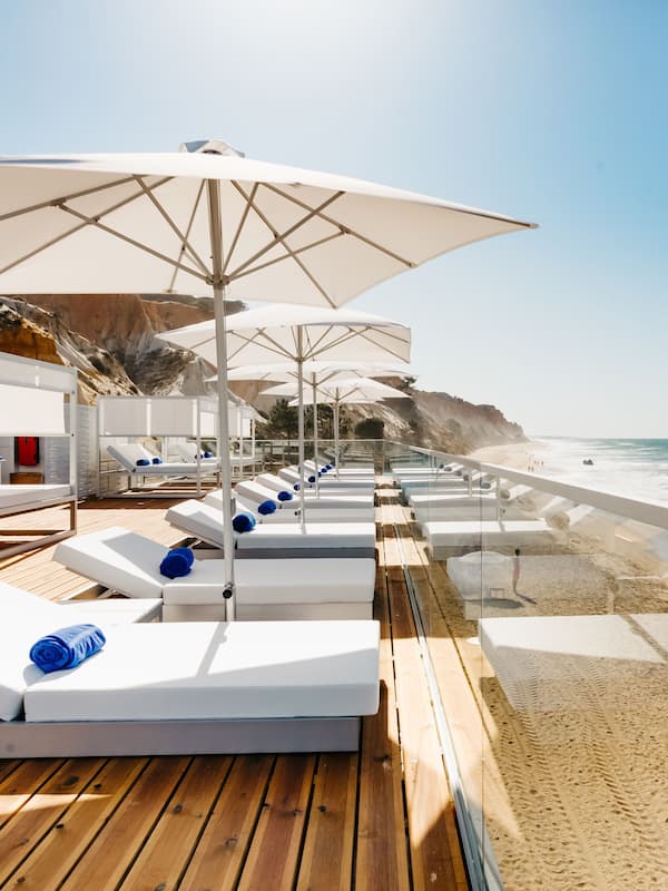 On the beach, sun loungers, beach umbrellas, beach towels
