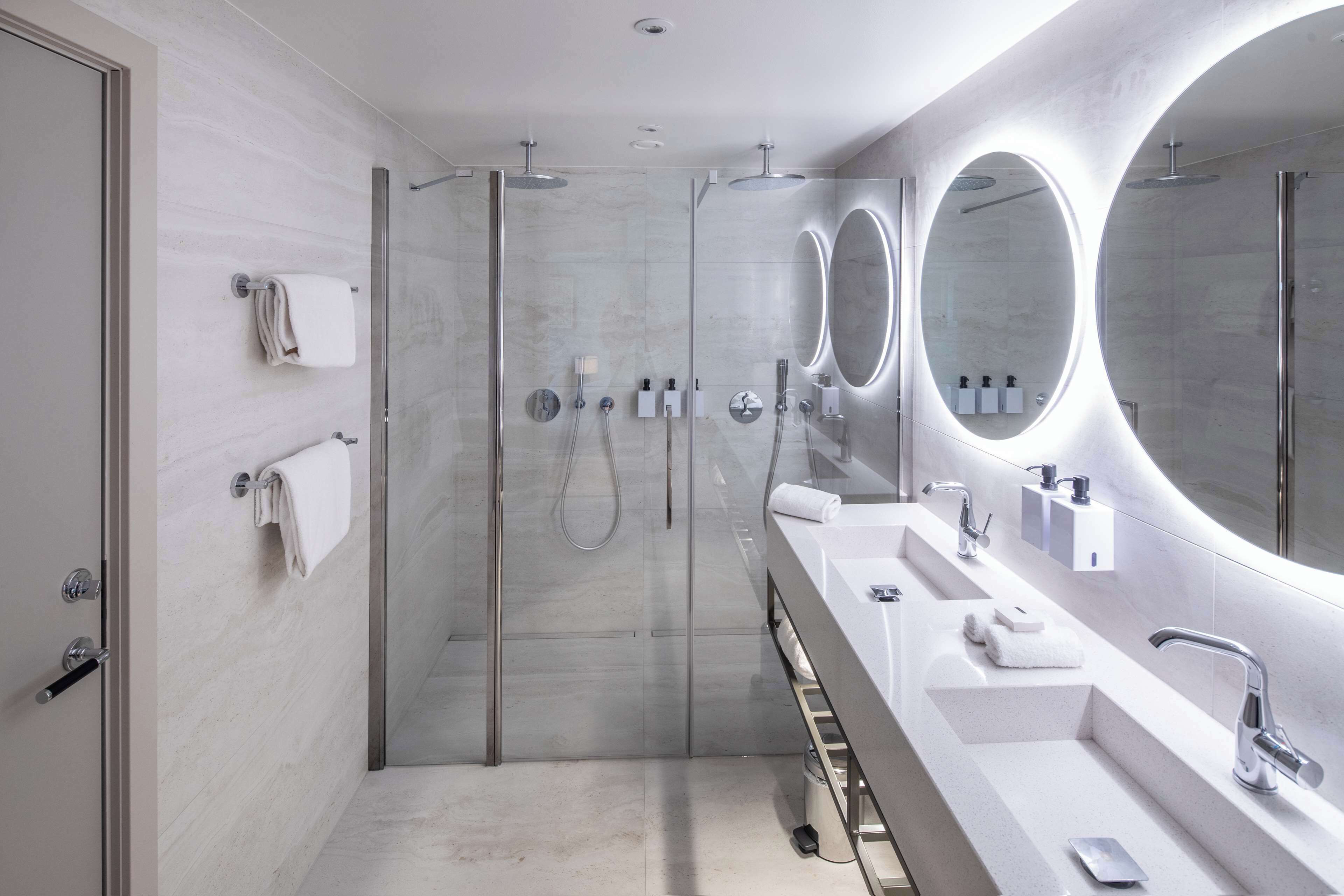 junior suite | bathroom | shower, hair dryer, heated floors, towels