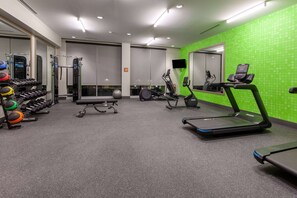 A gym with treadmills, a weight bench, and various exercise equipment. - La Quinta Inn & Suites by Wyndham Middletown-Goshen (Middletown)