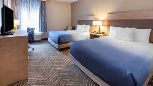 A hotel room with two beds, a desk, a TV, and a chair. - La Quinta Inn & Suites by Wyndham Middletown-Goshen (Middletown)