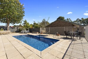 Outdoor pool, open 10:00 AM to 8:00 PM, pool umbrellas, pool loungers