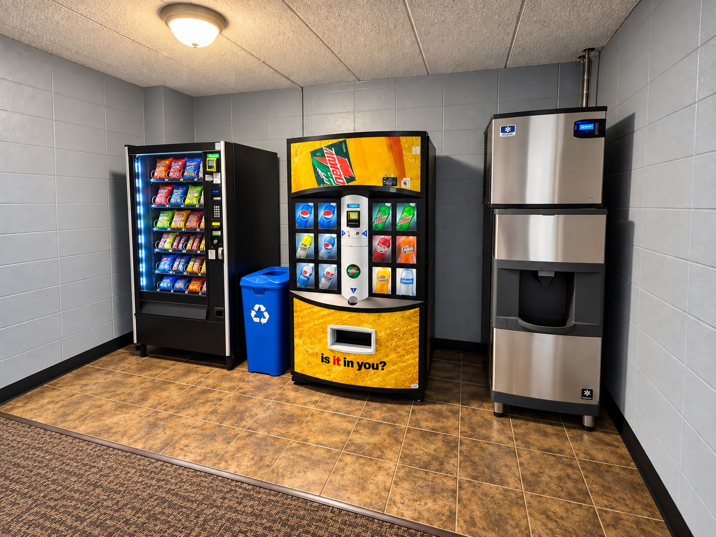 A vending area with a beverage dispenser, a trash bin, and a water cooler.