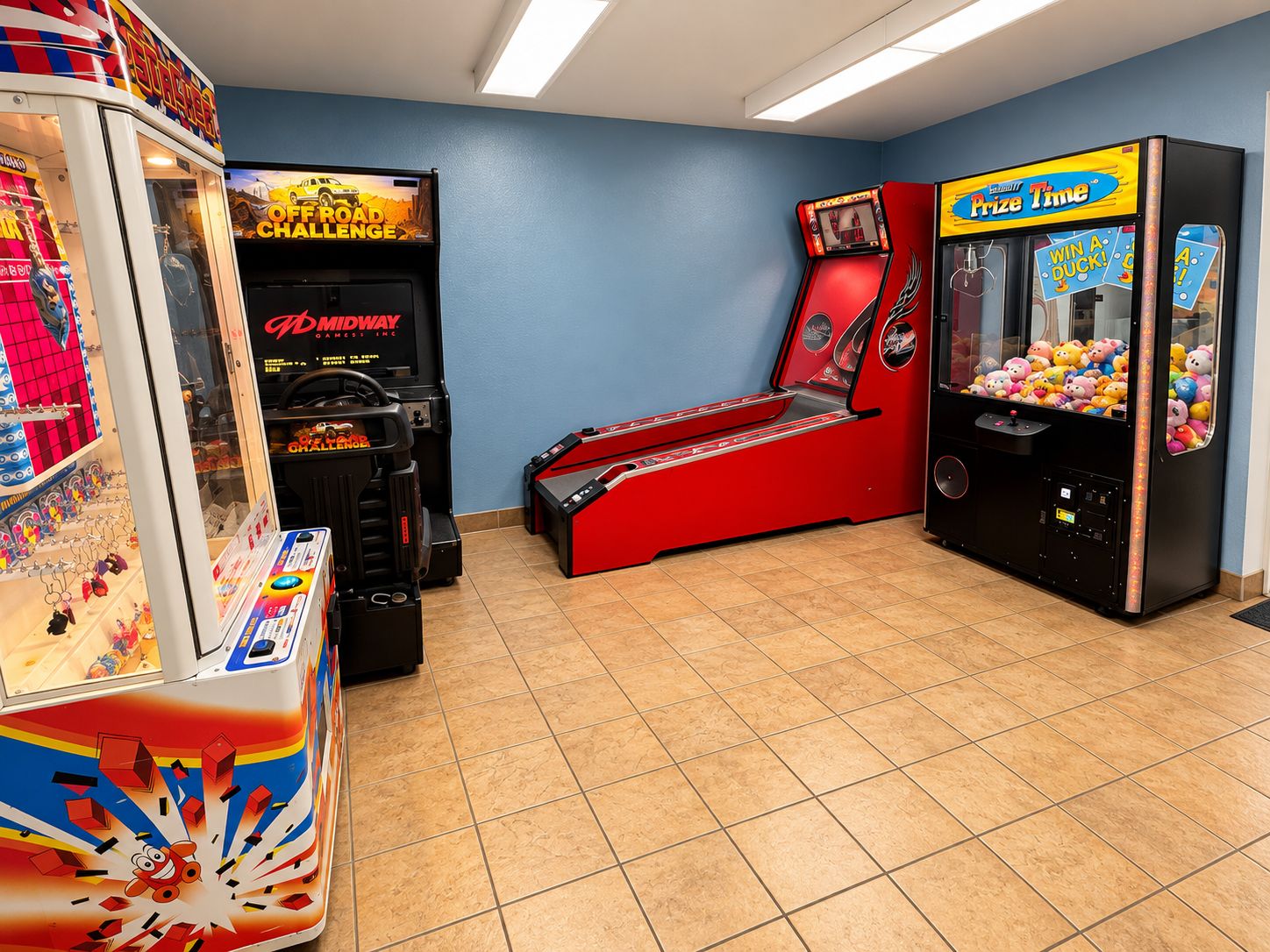 A gaming arcade with various machines, including a claw machine and racing games.