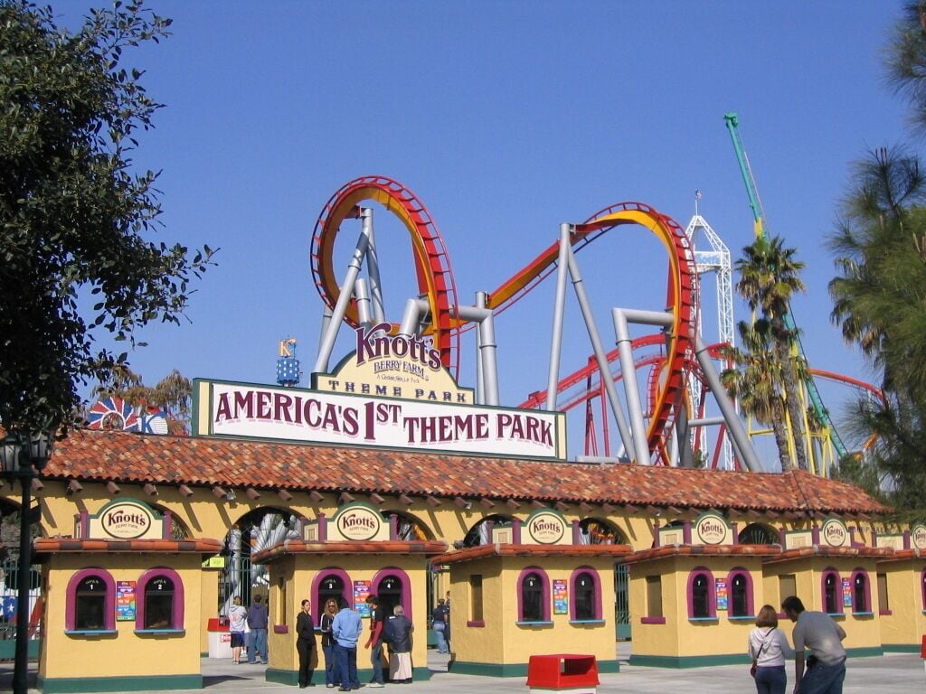A theme park entrance with a sign for 'America's 1st Theme Park' and 'Knot's Berry Farm'.