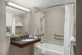 Combined shower/tub, deep soaking tub, hair dryer, towels at The Westin Long Beach