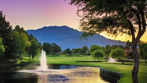A golf course with a pond, trees, and mountains in the background. - The Westin Rancho Mirage Golf Resort & Spa (Rancho Mirage)