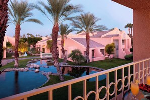 A resort with a pool, palm trees, and pink buildings. - The Westin Rancho Mirage Golf Resort & Spa (Rancho Mirage)
