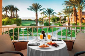 A dining table with breakfast items, a view of a golf course, and palm trees. - The Westin Rancho Mirage Golf Resort & Spa (Rancho Mirage)