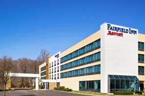 A Fairfield Inn Marriott hotel with a modern design, multiple floors, and a covered parking area. - Fairfield Inn by Marriott Philadelphia West Chester/Exton (Exton)