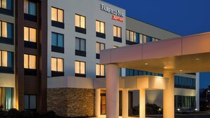A modern hotel with a prominent sign, multiple floors, and a covered entrance area. - Fairfield Inn by Marriott Philadelphia West Chester/Exton (Exton)