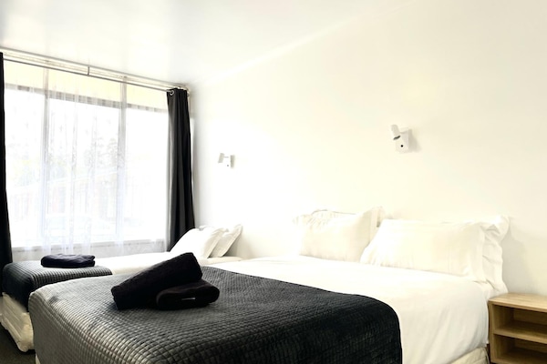Premium bedding, individually furnished, laptop workspace