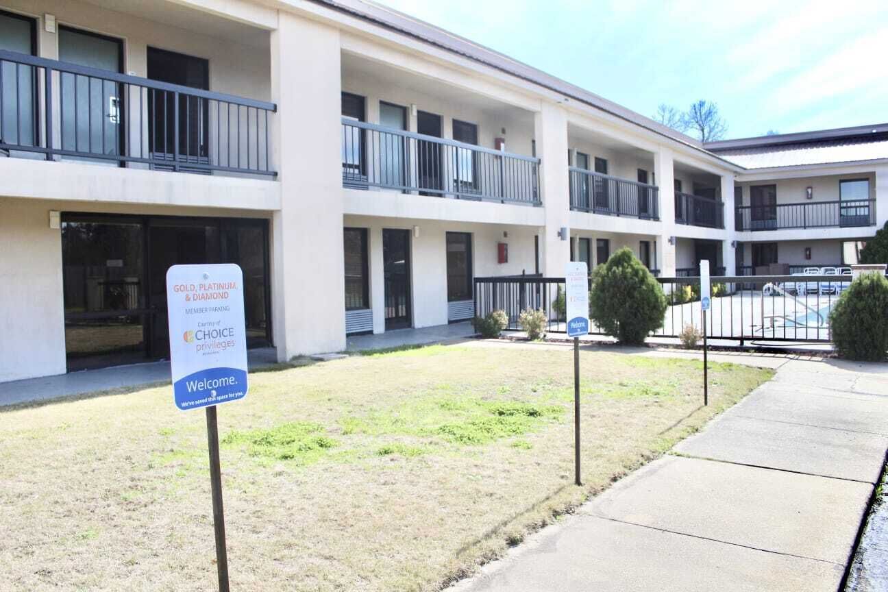 A multi-story building with a sign indicating GOLD, PLATINUM, and DIAMOND member privileges.