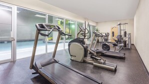 A gym with treadmills, elliptical machines, and weight equipment. - Super 8 by Wyndham Abbotsford BC (Abbotsford)
