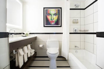 Combined shower/tub, designer toiletries, hair dryer, towels at Park Central Hotel New York