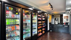 A row of beverage vending machines with various drink options. - Motel 6 Carson, CA (Carson)