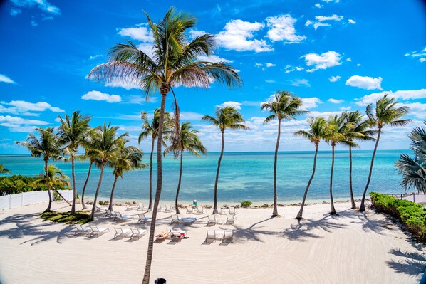 Private beach, white sand, sun loungers, beach towels