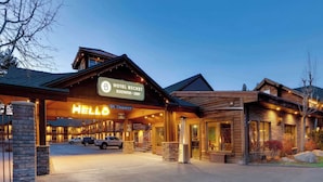 A hotel entrance with a 'Hotel Beckett' sign, a 'Hello' illuminated sign, and a 8ft clearance sign. - Hotel Becket, BW Signature Collection (South Lake Tahoe)